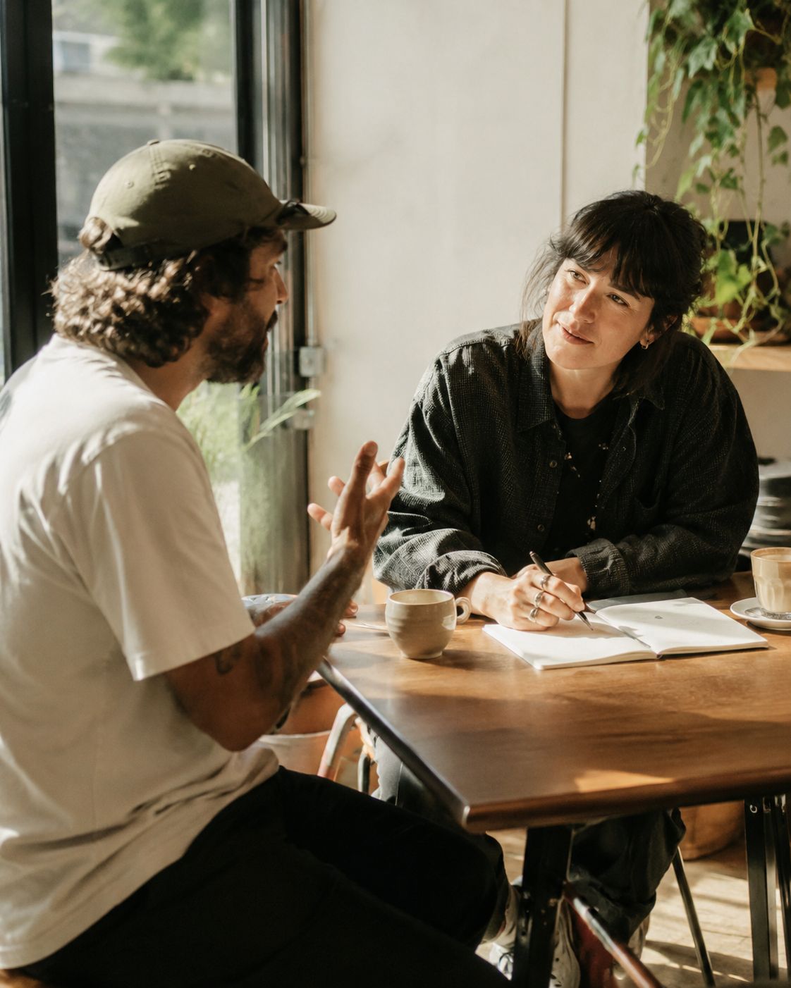 Someone talking with a customer or prospect. Editorial photography. Authentic. Not posed.